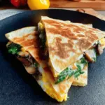 Healthy onion and egg mushroom wrap on a wooden board, perfect for a quick breakfast.